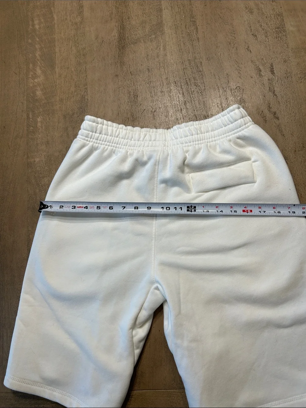 Corteiz Men's White Athletic Shorts with Dark Script Accent Medium